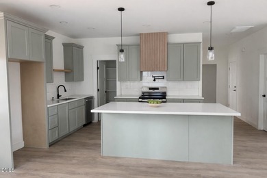 Stunning modern new construction in the gated lake community of on River Golf and Country Club at Lake Royale in North Carolina - for sale on GolfHomes.com, golf home, golf lot