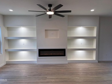 Stunning modern new construction in the gated lake community of on River Golf and Country Club at Lake Royale in North Carolina - for sale on GolfHomes.com, golf home, golf lot