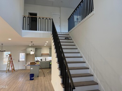 Stunning modern new construction in the gated lake community of on River Golf and Country Club at Lake Royale in North Carolina - for sale on GolfHomes.com, golf home, golf lot