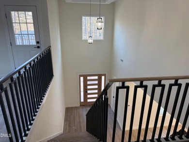 Stunning modern new construction in the gated lake community of on River Golf and Country Club at Lake Royale in North Carolina - for sale on GolfHomes.com, golf home, golf lot