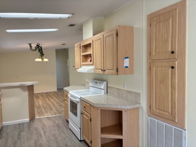 Welcome to this charming 3 bedroom, 2 bath Palm Harbor home on St. Johns Golf Club in Florida - for sale on GolfHomes.com, golf home, golf lot