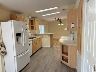Welcome to this charming 3 bedroom, 2 bath Palm Harbor home on St. Johns Golf Club in Florida - for sale on GolfHomes.com, golf home, golf lot
