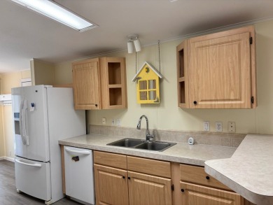 Welcome to this charming 3 bedroom, 2 bath Palm Harbor home on St. Johns Golf Club in Florida - for sale on GolfHomes.com, golf home, golf lot