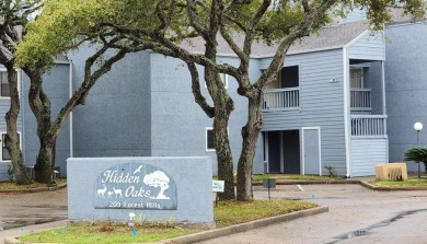 Ground level condo overlooking pool and fairwaypletely painted on Rockport Country Club in Texas - for sale on GolfHomes.com, golf home, golf lot