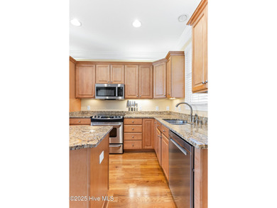 Welcome to life overlooking the first tee at Rivers Edge. Tucked on Rivers Edge Golf Club in North Carolina - for sale on GolfHomes.com, golf home, golf lot