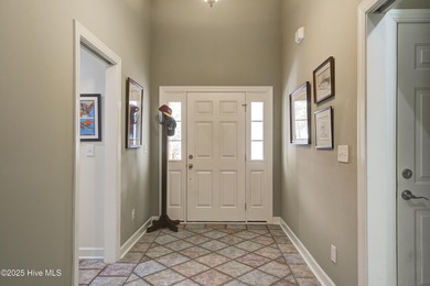 Nestled within a prestigious gated golf community, this on Brunswick Plantation and Golf Resorts in North Carolina - for sale on GolfHomes.com, golf home, golf lot