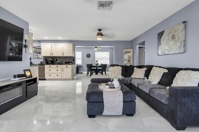 This beautiful Edgewood 2Br/2Ba model with a full Florida room on Leisureville Community Golf Course in Florida - for sale on GolfHomes.com, golf home, golf lot
