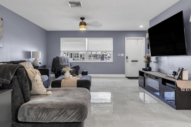 This beautiful Edgewood 2Br/2Ba model with a full Florida room on Leisureville Community Golf Course in Florida - for sale on GolfHomes.com, golf home, golf lot