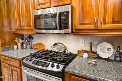 Nestled within a prestigious gated golf community, this on Brunswick Plantation and Golf Resorts in North Carolina - for sale on GolfHomes.com, golf home, golf lot