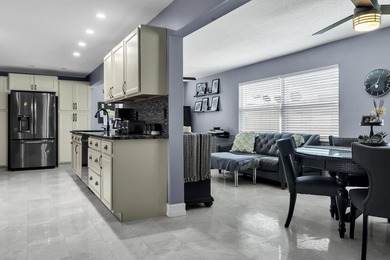 This beautiful Edgewood 2Br/2Ba model with a full Florida room on Leisureville Community Golf Course in Florida - for sale on GolfHomes.com, golf home, golf lot