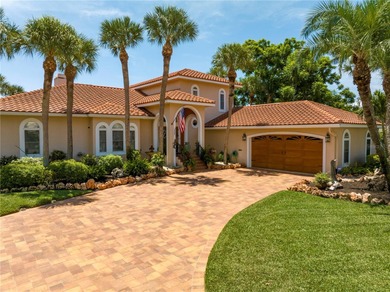 WELCOME TO PARADISE SAYS THIS WATERFRONT BEAUTY IN THE GATED & on Isla Del Sol Yacht and Country Club in Florida - for sale on GolfHomes.com, golf home, golf lot