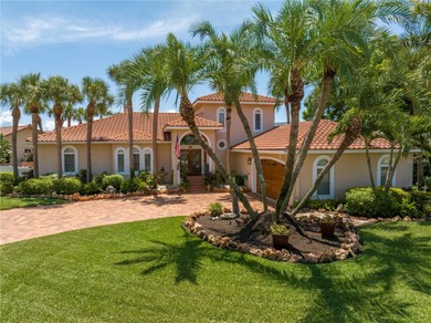 WELCOME TO PARADISE SAYS THIS WATERFRONT BEAUTY IN THE GATED & on Isla Del Sol Yacht and Country Club in Florida - for sale on GolfHomes.com, golf home, golf lot