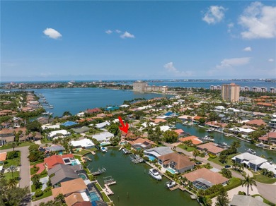 WELCOME TO PARADISE SAYS THIS WATERFRONT BEAUTY IN THE GATED & on Isla Del Sol Yacht and Country Club in Florida - for sale on GolfHomes.com, golf home, golf lot
