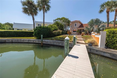 WELCOME TO PARADISE SAYS THIS WATERFRONT BEAUTY IN THE GATED & on Isla Del Sol Yacht and Country Club in Florida - for sale on GolfHomes.com, golf home, golf lot