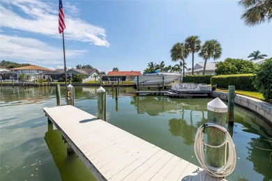 WELCOME TO PARADISE SAYS THIS WATERFRONT BEAUTY IN THE GATED & on Isla Del Sol Yacht and Country Club in Florida - for sale on GolfHomes.com, golf home, golf lot