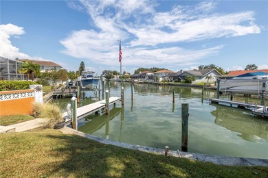 WELCOME TO PARADISE SAYS THIS WATERFRONT BEAUTY IN THE GATED & on Isla Del Sol Yacht and Country Club in Florida - for sale on GolfHomes.com, golf home, golf lot