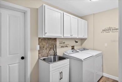 Refined Florida living awaits in this beautifully maintained on The Grand Club - Pine Lakes Course in Florida - for sale on GolfHomes.com, golf home, golf lot