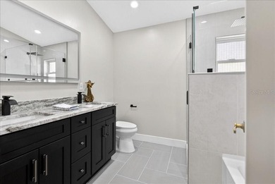 Refined Florida living awaits in this beautifully maintained on The Grand Club - Pine Lakes Course in Florida - for sale on GolfHomes.com, golf home, golf lot