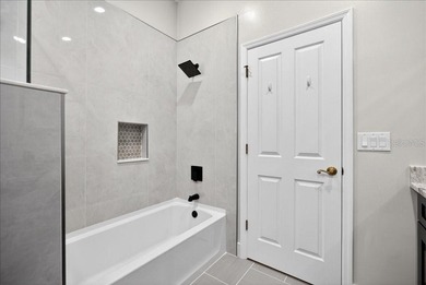 Refined Florida living awaits in this beautifully maintained on The Grand Club - Pine Lakes Course in Florida - for sale on GolfHomes.com, golf home, golf lot