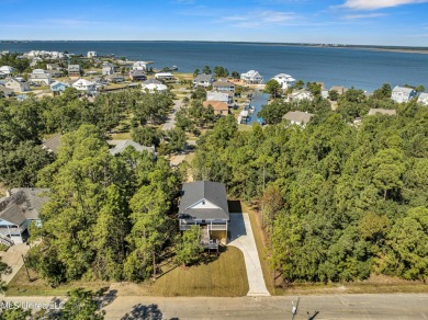 This beautiful new construction is a quick golf cart ride to all on Pass Christian Isles Golf Club in Mississippi - for sale on GolfHomes.com, golf home, golf lot