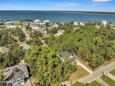 This beautiful new construction is a quick golf cart ride to all on Pass Christian Isles Golf Club in Mississippi - for sale on GolfHomes.com, golf home, golf lot