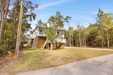 This beautiful new construction is a quick golf cart ride to all on Pass Christian Isles Golf Club in Mississippi - for sale on GolfHomes.com, golf home, golf lot