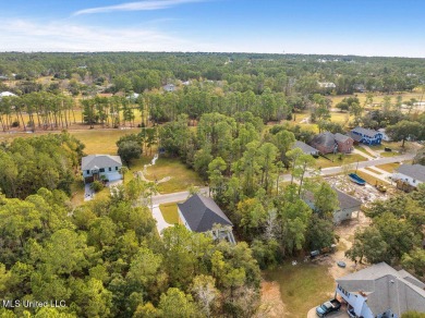 This beautiful new construction is a quick golf cart ride to all on Pass Christian Isles Golf Club in Mississippi - for sale on GolfHomes.com, golf home, golf lot