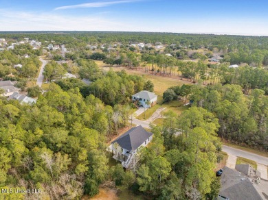 This beautiful new construction is a quick golf cart ride to all on Pass Christian Isles Golf Club in Mississippi - for sale on GolfHomes.com, golf home, golf lot