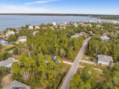 This beautiful new construction is a quick golf cart ride to all on Pass Christian Isles Golf Club in Mississippi - for sale on GolfHomes.com, golf home, golf lot