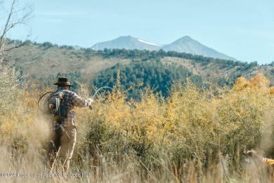 Discover the ease of single-floor living in this delightful on Ranch at Roaring Fork Golf Course in Colorado - for sale on GolfHomes.com, golf home, golf lot