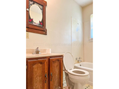 Welcome to your dream home at 1705 Takewell! This charming on Phillips Country Club in Texas - for sale on GolfHomes.com, golf home, golf lot