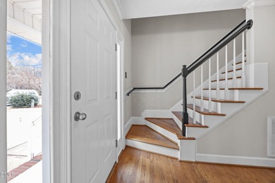 A rocking chair front porch welcomes you to your new home. Enter on Hedingham Golf and Athletic Club in North Carolina - for sale on GolfHomes.com, golf home, golf lot