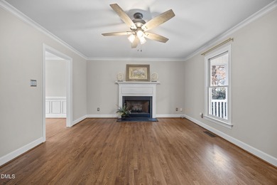 A rocking chair front porch welcomes you to your new home. Enter on Hedingham Golf and Athletic Club in North Carolina - for sale on GolfHomes.com, golf home, golf lot