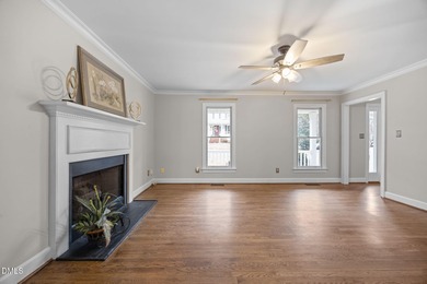 A rocking chair front porch welcomes you to your new home. Enter on Hedingham Golf and Athletic Club in North Carolina - for sale on GolfHomes.com, golf home, golf lot