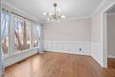 A rocking chair front porch welcomes you to your new home. Enter on Hedingham Golf and Athletic Club in North Carolina - for sale on GolfHomes.com, golf home, golf lot