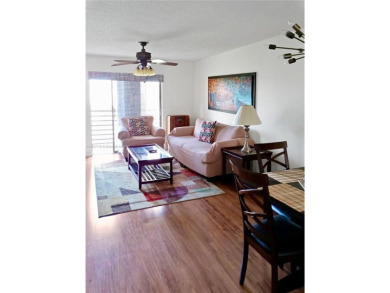 Enjoy stunning golf course and lake views from this bright on Sunrise Lakes Phase IV Golf Course in Florida - for sale on GolfHomes.com, golf home, golf lot