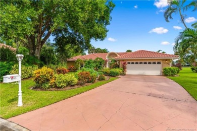 Welcome to this beautifully landscaped 4 bedroom, 2 bath home on St. Lucie Trail Golf Club in Florida - for sale on GolfHomes.com, golf home, golf lot