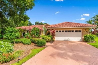 Welcome to this beautifully landscaped 4 bedroom, 2 bath home on St. Lucie Trail Golf Club in Florida - for sale on GolfHomes.com, golf home, golf lot