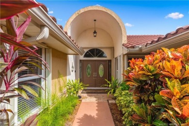 Welcome to this beautifully landscaped 4 bedroom, 2 bath home on St. Lucie Trail Golf Club in Florida - for sale on GolfHomes.com, golf home, golf lot