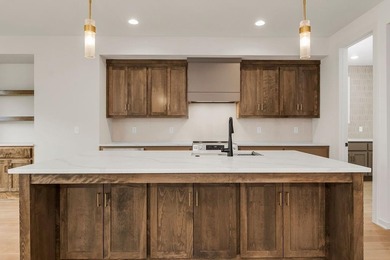 The Woodland by Elevate Design + Build is a reverse 1.5-story 5 on Heritage Park Golf Course in Kansas - for sale on GolfHomes.com, golf home, golf lot