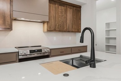 The Woodland by Elevate Design + Build is a reverse 1.5-story 5 on Heritage Park Golf Course in Kansas - for sale on GolfHomes.com, golf home, golf lot