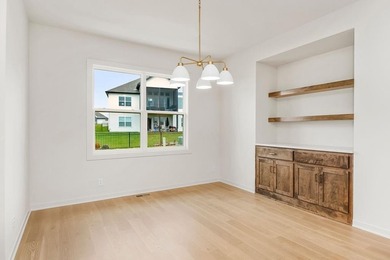 The Woodland by Elevate Design + Build is a reverse 1.5-story 5 on Heritage Park Golf Course in Kansas - for sale on GolfHomes.com, golf home, golf lot