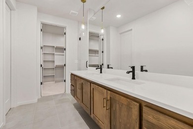 The Woodland by Elevate Design + Build is a reverse 1.5-story 5 on Heritage Park Golf Course in Kansas - for sale on GolfHomes.com, golf home, golf lot