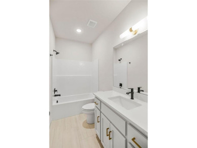 The Woodland by Elevate Design + Build is a reverse 1.5-story 5 on Heritage Park Golf Course in Kansas - for sale on GolfHomes.com, golf home, golf lot