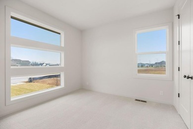 The Woodland by Elevate Design + Build is a reverse 1.5-story 5 on Heritage Park Golf Course in Kansas - for sale on GolfHomes.com, golf home, golf lot