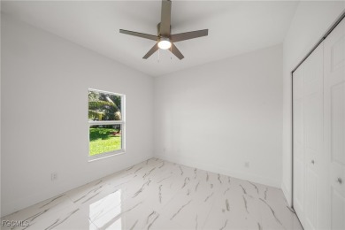 Stunning brand new modern home offering 3 bedrooms plus a on Del Tura Golf and Country Club in Florida - for sale on GolfHomes.com, golf home, golf lot