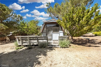 Tucked into a sunny, quiet corner of Pine Mountain Club, this on Pine Mountain Club in California - for sale on GolfHomes.com, golf home, golf lot
