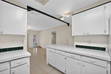 Live the carefree Florida lifestyle in this spacious 2-bedroom on Sandpiper Golf Club in Florida - for sale on GolfHomes.com, golf home, golf lot