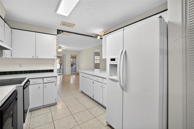 Live the carefree Florida lifestyle in this spacious 2-bedroom on Sandpiper Golf Club in Florida - for sale on GolfHomes.com, golf home, golf lot