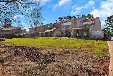 Experience lake life with unending water views, a covered slip on Stone Creek Cove Golf Course in South Carolina - for sale on GolfHomes.com, golf home, golf lot